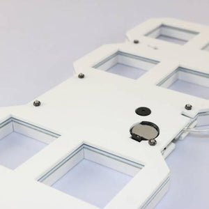 Stylish & Unique Electronic Desk Clock Vst-883-white - the white rear casing with a circular battery compartment, a small speaker, and screws.
