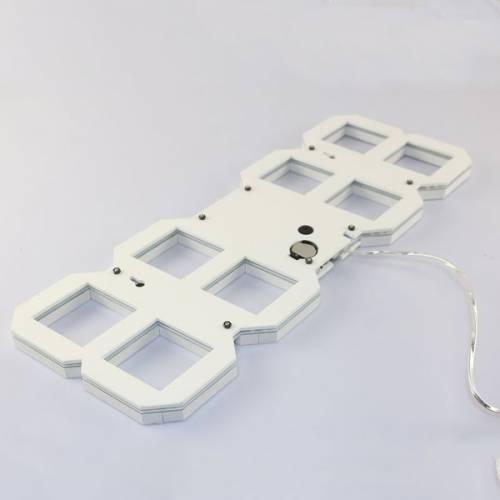 Stylish & Unique Electronic Desk Clock Vst-883-white - shown from the back, featuring a white frame, a circular battery compartment, and a power cable.