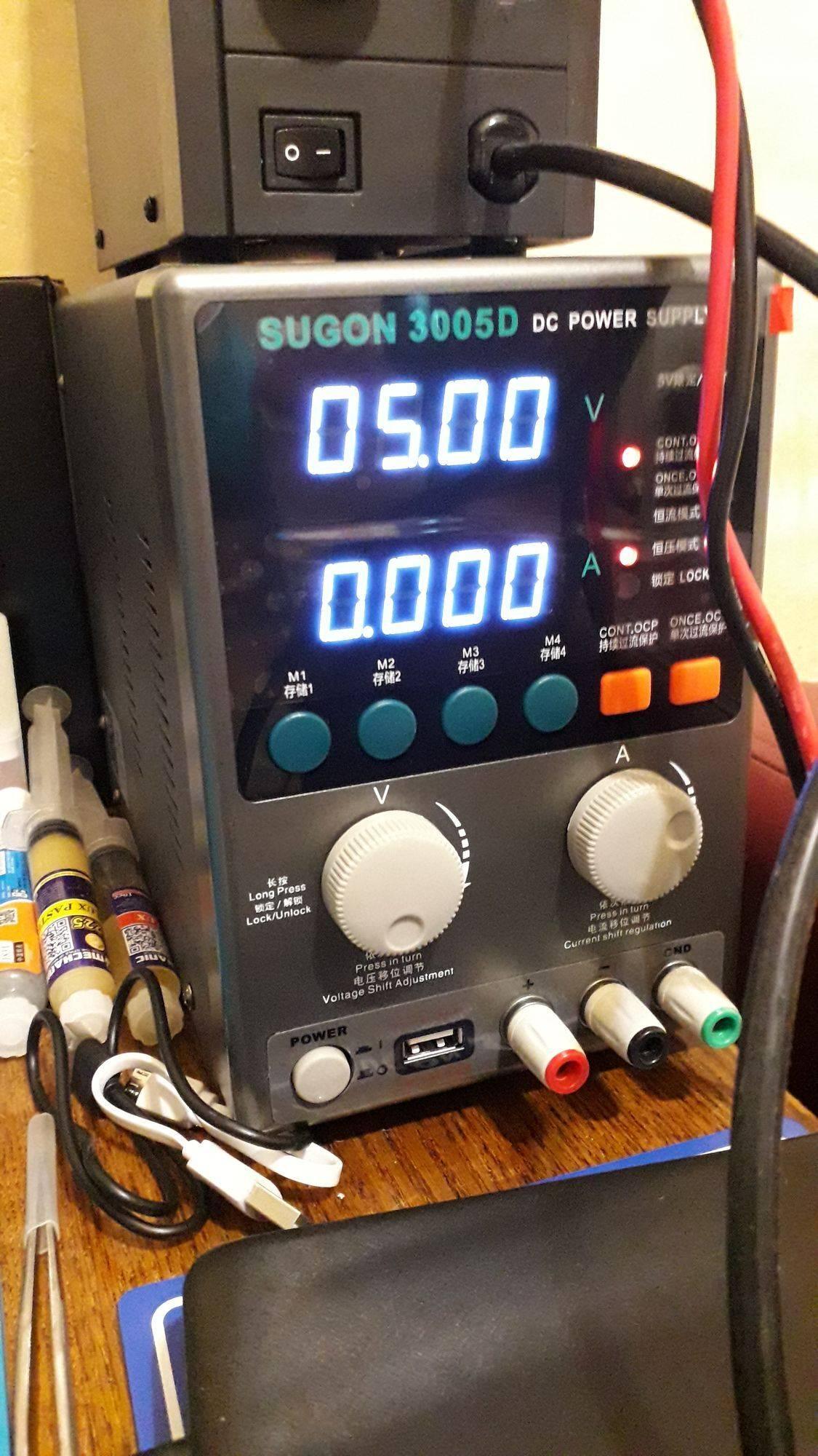 Sugon 3005D Regulated Power Supply - with a grey housing, digital display showing 05.00 V and 0.000 A, control knobs, buttons, and output ports.