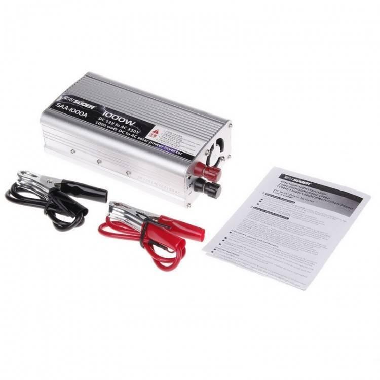 Suoer 500W 12V To 230V Inverter Silver - shown with black and red battery clamps and an instruction manual on a white background.