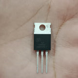 SVG104R5NT N-Channel Power MOSFET - a black three-pin electronic component with a metal heat sink tab, held against a human palm.