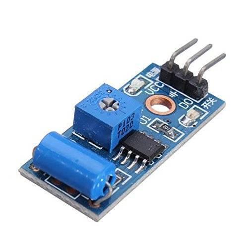 Sw-420 Vibration Sensor - a blue cylindrical sensor, a blue potentiometer, a black IC, and a three-pin header on a blue circuit board.