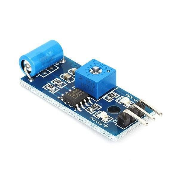 Sw-420 Vibration Sensor - module on a blue PCB with a cylindrical vibration switch, a blue potentiometer, an LM393 chip, and a three-pin header.