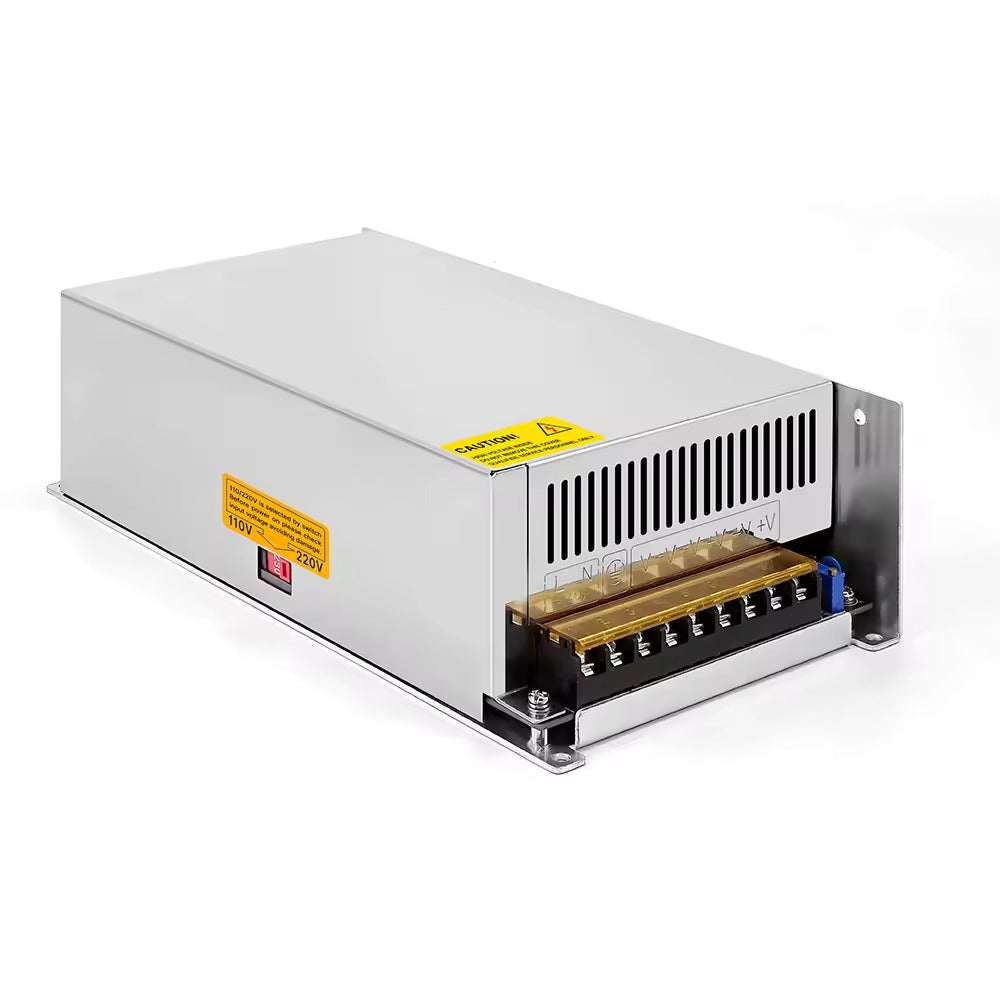 Switching Power Supply 68V 14.7A - a rectangular silver metal unit with a side voltage selector switch, a caution label, and a terminal block for wiring.
