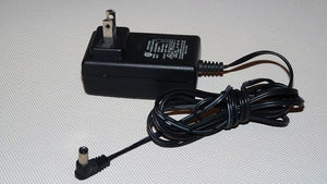 Switching Power Supply Adapter S012BU2400050 24V 400mA - a black wall-plug power adapter with an attached cord and a right-angle DC barrel connector.