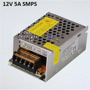 Switching Power Supply SMPS 12V 5A - a metallic, rectangular power supply unit with a perforated top cover, screw terminals, and a voltage adjustment knob.