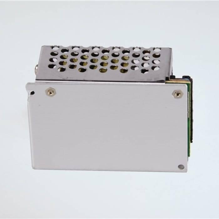 Switching Power Supply SMPS 12V 5A - shown as a silver-coloured metal rectangular unit with a perforated top cover and a side-mounted circuit board.