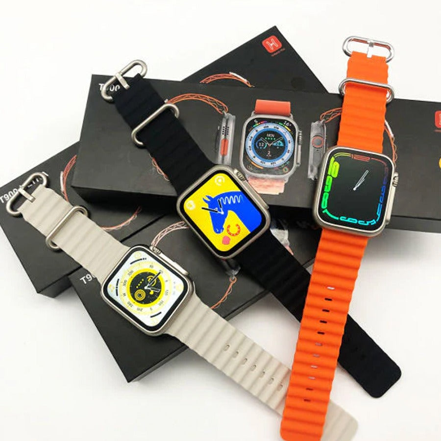 T900 Ultra 2 smart watch with 2.19 big display Vital b - three watches with grey, black, and orange bands and digital displays atop their black packaging boxes.