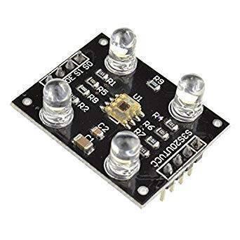 TCS3200 Color Sensor Module - a black rectangular circuit board featuring four LEDs, a central sensor chip, and two rows of pin headers.