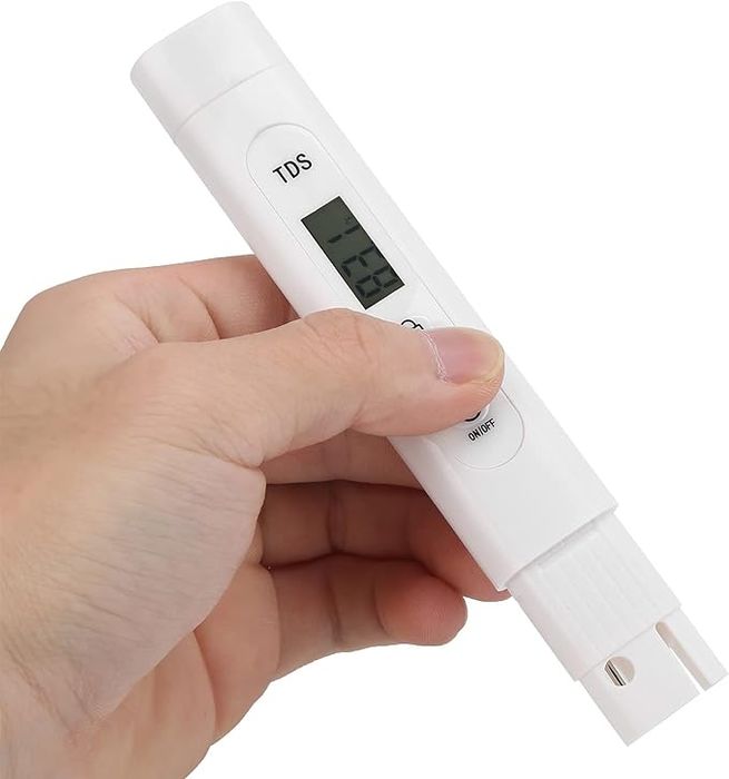 TDS Meter Digital Water Quality Tester - a white plastic body with an LCD screen displaying 831 and an ON/OFF button.