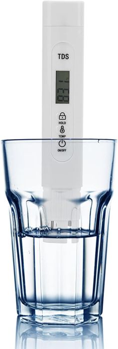 TDS Meter Digital Water Quality Tester - a white, pen-shaped device with a digital display showing 831, held upright in a glass of water.
