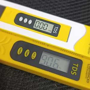 TDS Meter - Water Quality Tester - two yellow handheld devices with digital displays reading 000 PPM and 906, featuring On/Off, Temp, and Hold buttons.