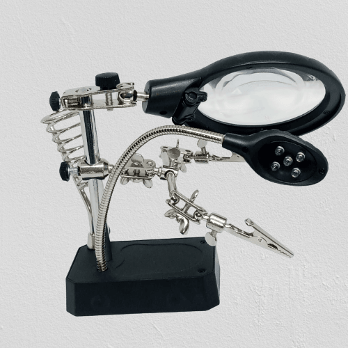 TE 800 Magnifying Glass 5 LED Auxiliary Clip Magnifier 3 In 1 Hand Soldering Solder Iron Stand Holder Station - a black base, a magnifying lens, a 5-LED light, and two adjustable metal alligator clips.