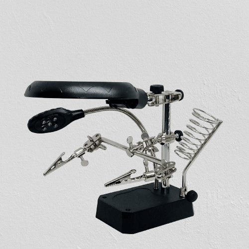 TE 800 Magnifying Glass 5 LED Auxiliary Clip Magnifier 3 In 1 Hand Soldering Solder Iron Stand Holder Station - a black base, two metal alligator clips, a magnifying lens, an LED light, and a solder stand.
