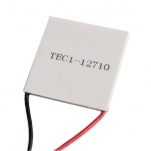 TEC1 12710 Thermoelectric Cooler Peltier Module 12VDC 10A 40x40x3.2mm - a square white ceramic plate with printed text and one black and one red wire extending from the side.