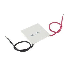 TEC1 12710 Thermoelectric Cooler Peltier Module 12VDC 10A 40x40x3.2mm - a square white plate with one black wire and one red wire attached.