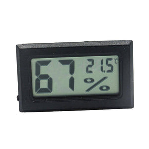 Temperature And Humidity Meter - a black rectangular frame with a digital LCD screen displaying 67% humidity and 21.5 degrees.
