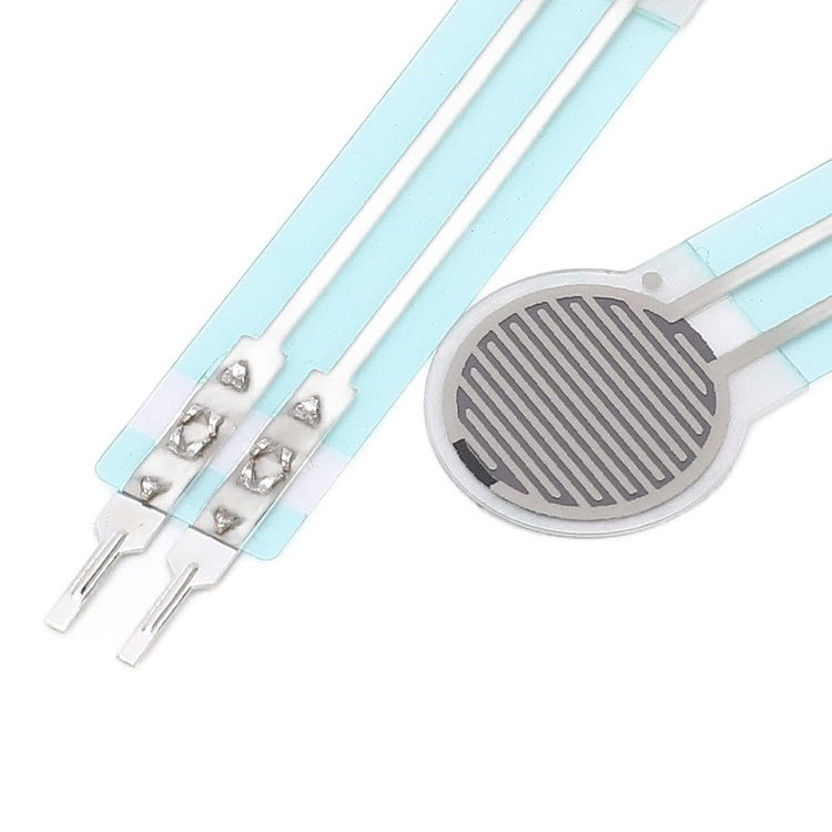 Thin Film Pressure Force Sensor FSR Flexible Bend Sensitive Resistor 20G to 3kg RP-C10-LT - a circular silver-grey sensor pad with two long, flat, flexible electrical connector tails.