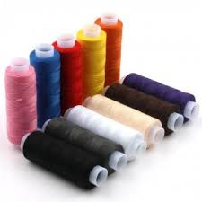 Thread on Reels - a collection of ten multicolored sewing thread spools arranged in two rows against a white background.