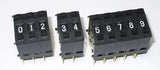 ThumbWheel BCD Switch - shown as three separate black modular units displaying the digits 0 through 9 on individual push-button wheels.