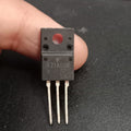 TK31A60W 600V 30.8A N-Channel Power MOSFET - a black, three-pin electronic component held by fingers, featuring the text "K31A60W" printed on its front surface.
