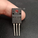 TK31A60W 600V 30.8A N-Channel Power MOSFET - a black, three-pin electronic component held by fingers, featuring the text "K31A60W" printed on its front surface.