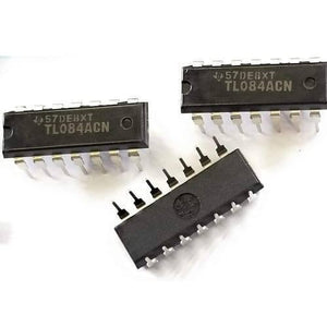 TL084 Quad Operational Amplifier IC - three black 14-pin dual in-line package integrated circuits laid out on a white surface.