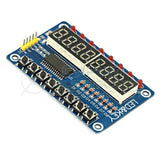TM1638 8 Digit 7 Segment Display With LED’s And Switches - blue circuit board featuring eight push buttons, eight LEDs, and two four-digit displays.