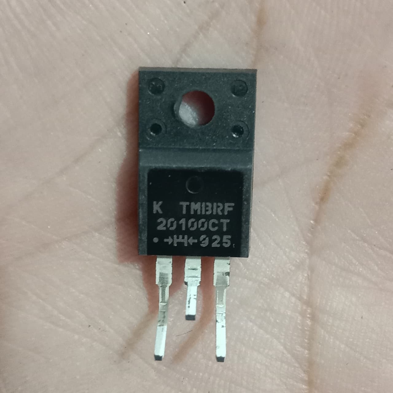 TMBRF20100CT 100V 20A Dual Trench Schottky Diode - a black three-pin electronic component with text printed on its surface, shown in a close-up view.