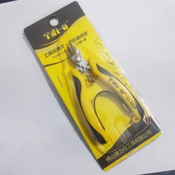 Tni-u Mini Ergonomic Palm Held Smart Locking Pliers Cutter TU-A036 - shown inside its original retail blister packaging.