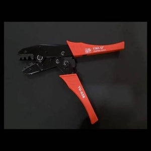 Tni-u TU-03B Cable Crimper Crimping Tool - shown as a black metal crimping tool with red ergonomic handles on a plain black background.