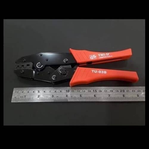 Tni-u TU-03B Cable Crimper Crimping Tool - shown in black and orange with a metal ruler placed below it for scale.