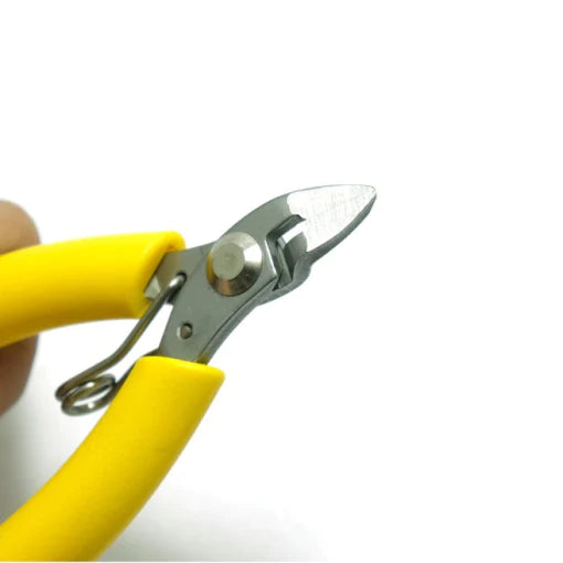 Tni-u TU-109A Wire Cutter - a close-up of the metal cutting head with yellow plastic-coated handles and a small tension spring.