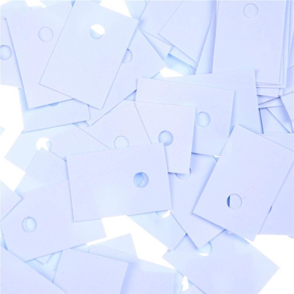 TO-220 Silicon Rubber Pad Insulation Silicon Heatsink Silicon Sheet - a pile of light blue rectangular silicone pads with a single circular hole.