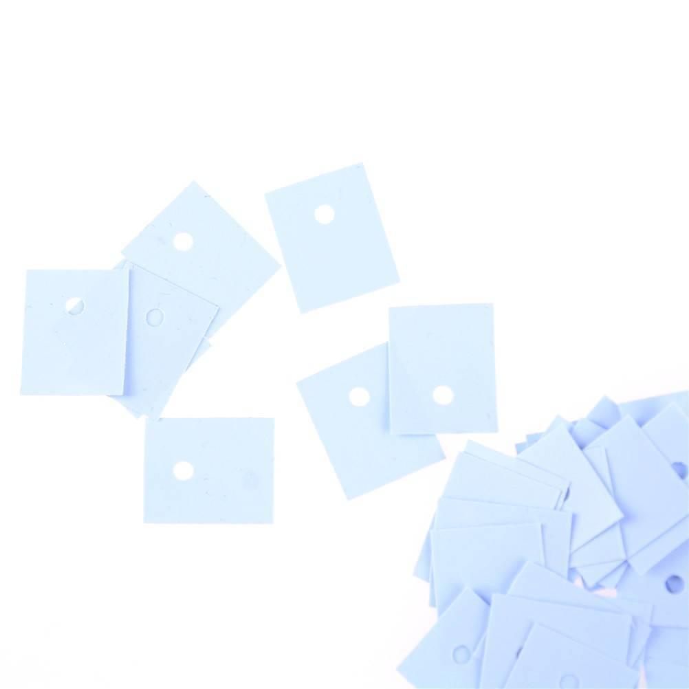 TO-3p Silicon Rubber Sheets Insulation Transistor Thermal Pad Silicone Insulation Silicone Foil Pad - a pile of light blue rectangular silicone pads with a single circular hole in each.