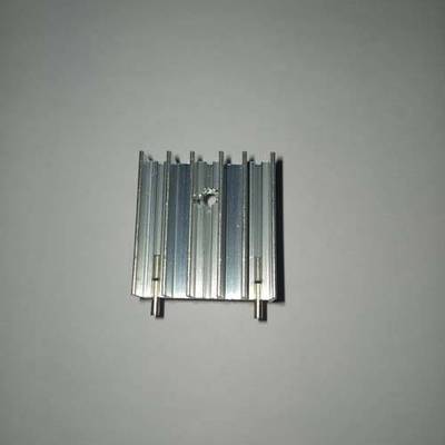 TO3P Black And Silver Heat Sink - shown as an aluminum extruded heatsink with vertical fins and two mounting pins on a plain background.