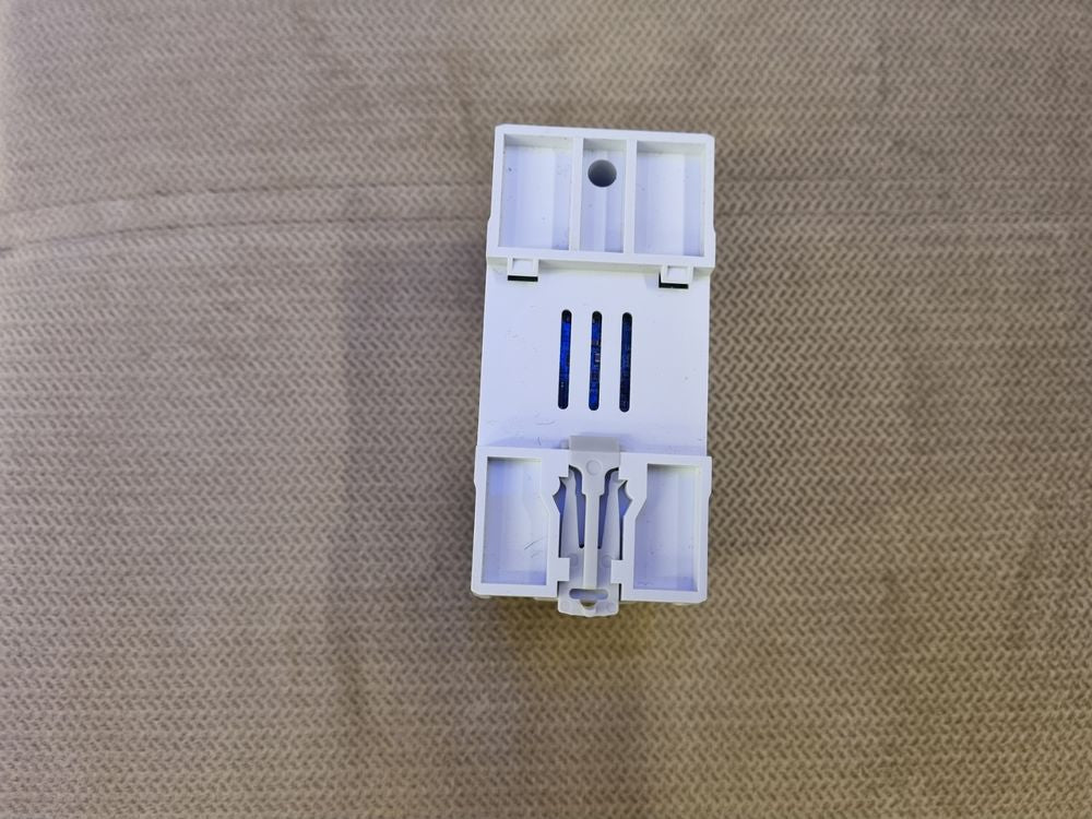 Tomzn 63A WiFi Smart Switch Tuya Energy Meter kWh Metering Circuit Breaker Timer With Voltage Current And Leakage Protection - rear view showing the white plastic casing, ventilation slots, and a grey DIN rail mounting clip.