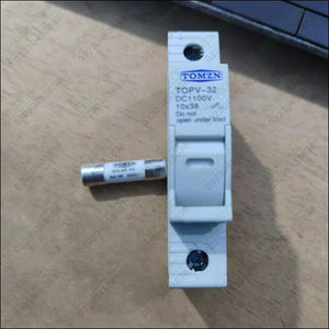 TOMZN TOPV-32X DC 1100V PV Fuses for Solar System Protection - holder in white plastic with a cylindrical 10x38 solar fuse placed horizontally beside it on a wooden surface.