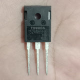 Toshiba S24N65FB Power MOSFET - a black rectangular electronic component with three metal pins, held against a palm.