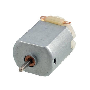 Toy Motor Mini DC Motor Mini Electric Motor PMMC Motor - a small silver-coloured rectangular electric motor with a protruding metal shaft and two copper contact terminals.