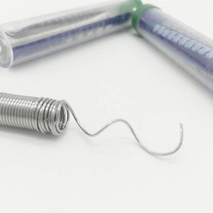 TP3131-88 Suoer 0.8mm Solder Wire 2 Meter - shown as a silver coiled wire with a wavy end, positioned in front of two clear plastic storage tubes.