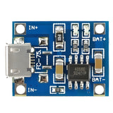 TP4056 Lithium Battery And 18650 Charger Module 1A 3.7V - a blue rectangular circuit board featuring a micro-USB port, a 4056E chip, and labeled IN and BAT terminals.