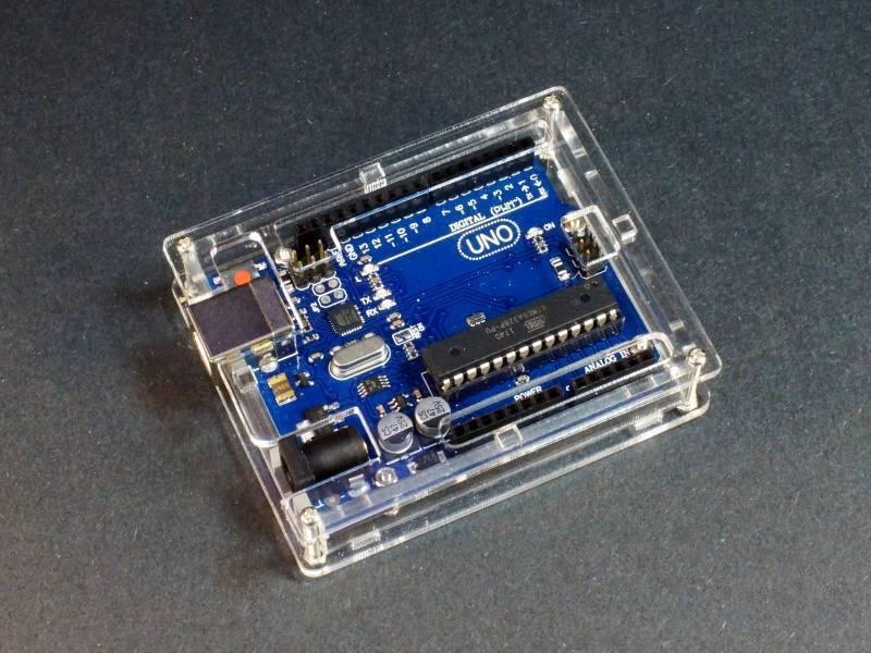 Transparent Acrylic Case Shell Enclosure Gloss Box For Arduino Uno R3 - housing a blue Arduino Uno board with visible USB, power, and digital pin ports.
