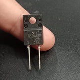 TRS8A65F 650V 8A Schottky Barrier Diode - a close-up of the black rectangular electronic component with two metal pins held between fingers.