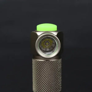 TrustFire Z1 Flashlight Cree XP-E 280 lumens 1XCR123A/16340 - a close-up view of the metallic grey cylindrical body, the side-mounted light lens, and the green rubberized power button.
