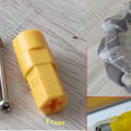 TT Motor Groove 7mm Plastic Coupling Shaft Hexagon Motor Coupler Wheel Tyre Mount - two yellow plastic couplers, a metal screw, and a mounted wheel.
