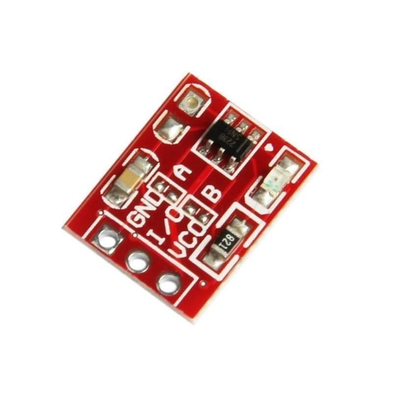 TTP223 Touch Sensor Module Touch Sensor For Arduino And Raspberry Pi - a small rectangular red circuit board with three circular pin holes, a black integrated circuit, and labeled GND, I/O, and VCC.
