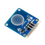 TTP223B Capacitive Touch Sensor Module - a square blue circuit board featuring a circular touch pad and three metal pins labeled SIG, VCC, and GND.