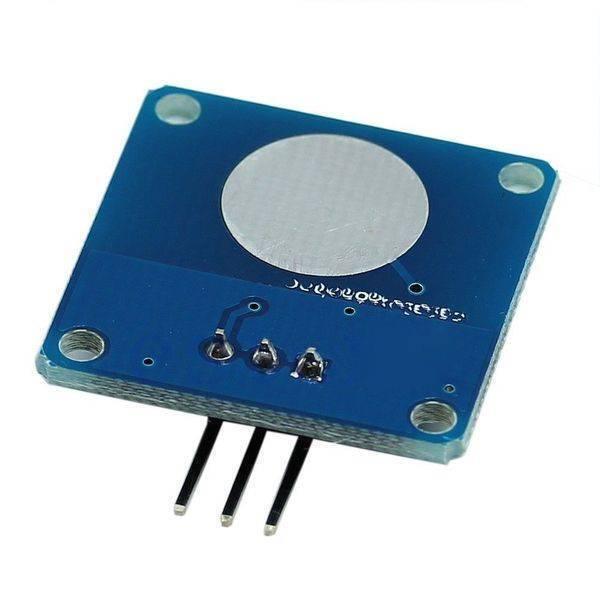 TTP223B Capacitive Touch Sensor Module - the square blue circuit board with a circular metal touch pad and three downward-facing connector pins.