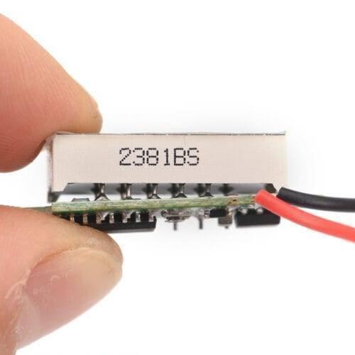 Two Wire 0.28 Inch LED Mini DC Voltmeter Digital Display Voltage Tester Meter - shown as a close-up of the side with red and black wires attached.